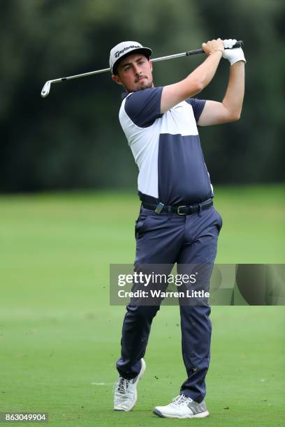 Alfie Plant of England hits his second shot on the 18th hole during day one of the Andalucia Valderrama Masters at Real Club Valderrama on October...