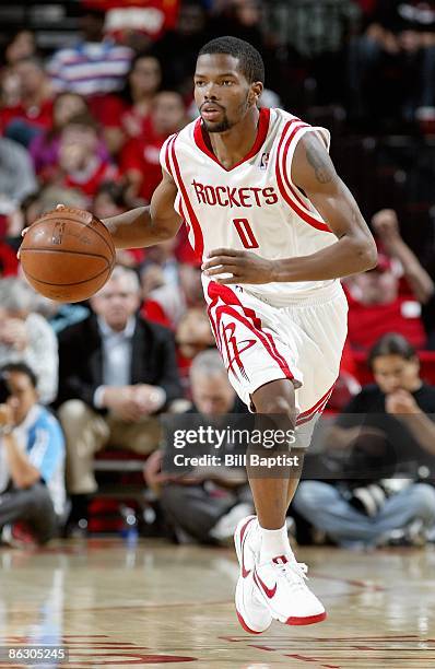 Aaron Brooks of the Houston Rockets brings the ball upcourt against the Portland Trail Blazers in Game Four of the Western Conference Quarterfinals...