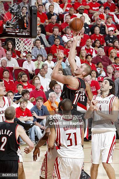 Joel Przybilla of the Portland Trail Blazers puts up a shot against the Houston Rockets in Game Four of the Western Conference Quarterfinals during...
