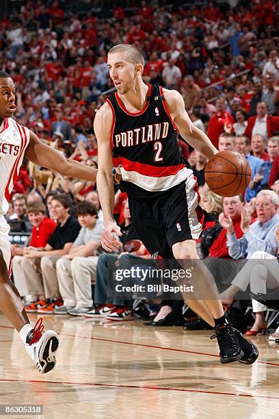 Steve Blake of the Portland Trail Blazers surveys the court against Kyle Lowry of the Houston Rockets in Game Four of the Western Conference...