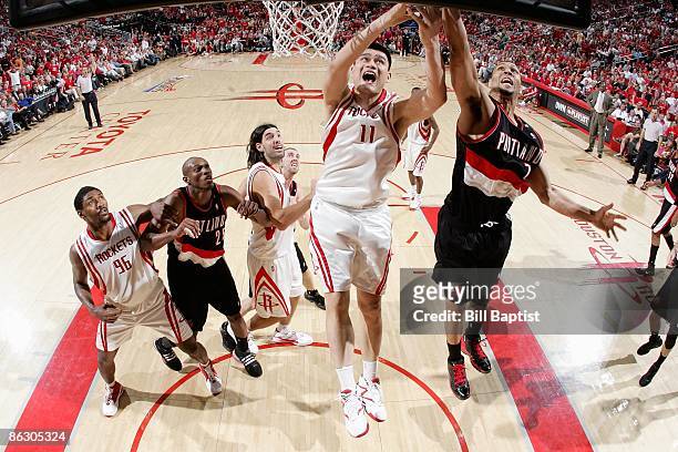 Brandon Roy of the Portland Trail Blazers goes to the basket against Yao Ming of the Houston Rockets in Game Four of the Western Conference...