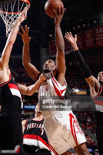 Ron Artest of the Houston Rockets goes to the basket under pressure against the Portland Trail Blazers in Game Four of the Western Conference...