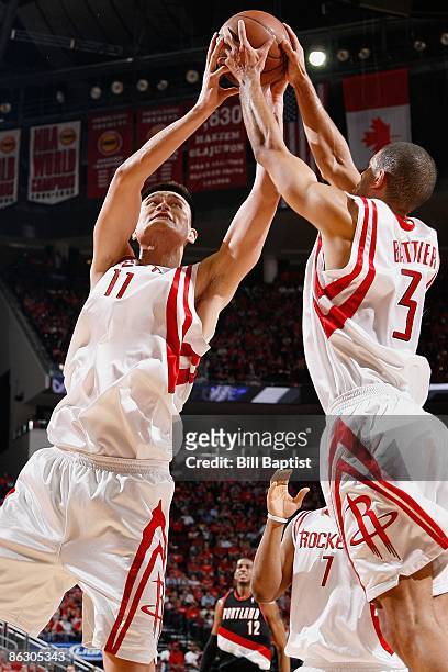 Yao Ming and Shane Battier of the Houston Rockets go for the rebound against the Portland Trail Blazers in Game Four of the Western Conference...