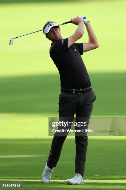 Ben Evans of England hits his second shot on the 9th hole during day one of the Andalucia Valderrama Masters at Real Club Valderrama on October 19,...