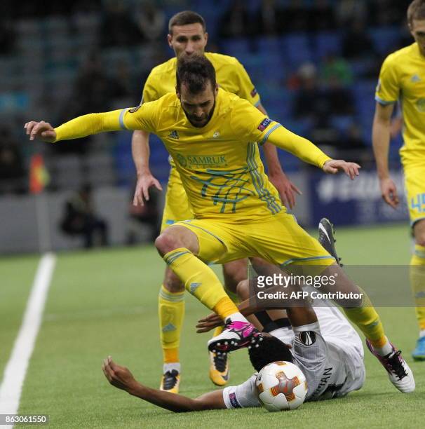 Astana's defender from Bosnia-Herzegovina Marin Anicic and Maccabi Tel Aviv's forward from England Nick Blackman vie for the ball during the UEFA...