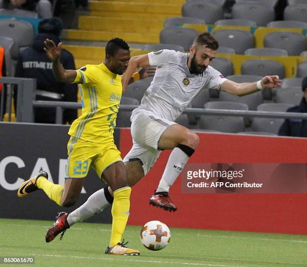 Astana's forward from Ghana Patrick Twumasi and Maccabi Tel Aviv's midfielder from Bosnia-Herzegovina Tino Susic vie for the ball during the UEFA...