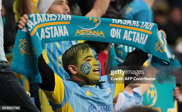 Astana's fans support their team during the UEFA Europa League Group A football match between FC Astana and Maccabi Tel-Aviv FC at the Astana Arena...