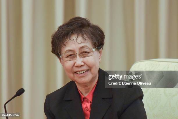 Former Vice-Chair of the 11th Standing Committee of the National People's Congress Uyunqimg attends a meeting of the 19th Communist Party Congress at...