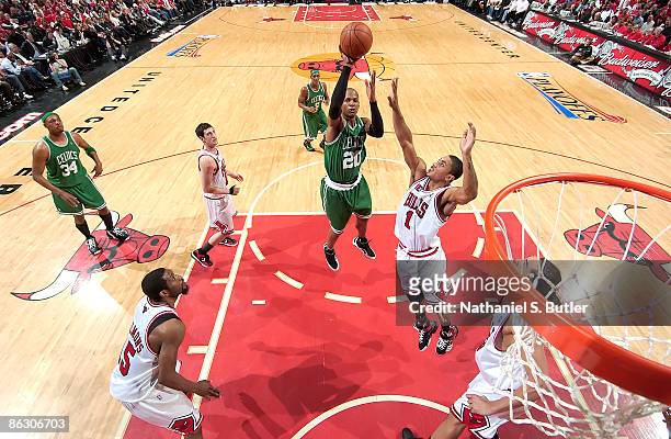 Ray Allen of the Boston Celtics goes to the basket over Derrick Rose of the Chicago Bulls during Game Six of the Eastern Conference Quarterfinals as...