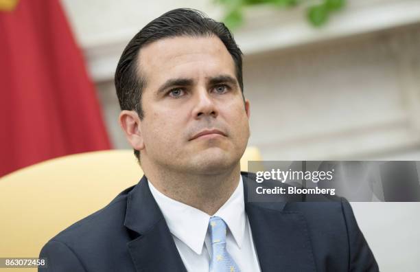 Ricardo Rossello, governor of Puerto Rico, listens during a meeting with U.S. President Donald Trump, not pictured, during a meeting in the Oval...