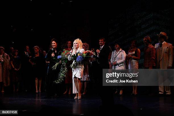 Writer Patricia Resnick singer Dolly Parton on stage during curtain call at the opening of "9 to 5: The Musical" on Broadway at the Marriott Marquis...