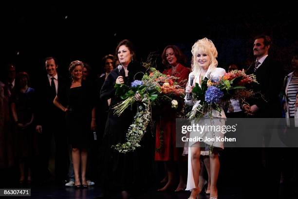 Writer Patricia Resnick singer Dolly Parton on stage during curtain call at the the opening of "9 to 5: The Musical" on Broadway at the Marriott...