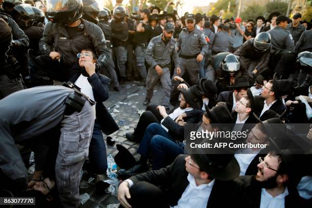 Israeli security forces disperse Ultra-Orthodox Jewish demonstrators during a protest against Israeli army conscription in the centre of Jerusalem on...