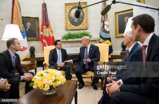 President Donald Trump meets with Governor Ricardo Rossello of Puerto Rico during a meeting in the Oval Office at the White House on October 19, 2017...