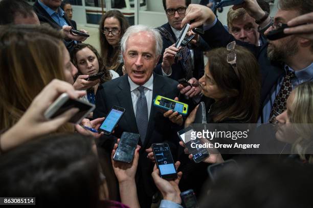 Sen. Bob Corker talks to reporters as he heads to a vote on amendments to the fiscal year 2018 budget resolution, on Capitol Hill, October 19, 2017...