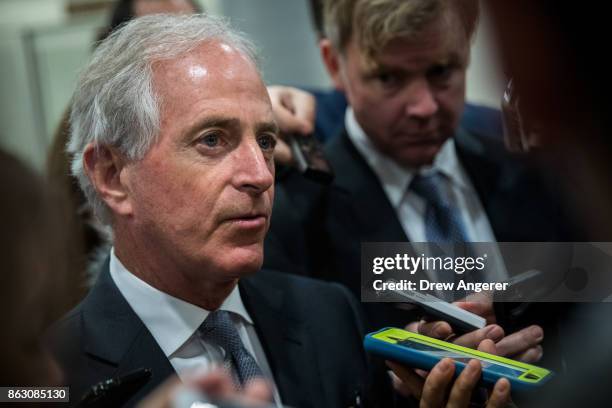 Sen. Bob Corker talks to reporters as he heads to a vote on amendments to the fiscal year 2018 budget resolution, on Capitol Hill, October 19, 2017...