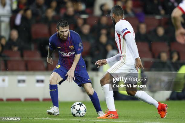 Lionel Messi of FC Barcelona, Alaixys Romao of Olympiacos during the UEFA Champions League group D match between FC Barcelona and Olympiacos on...