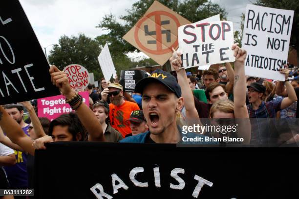 Demonstrators gather at the site of a planned speech by white nationalist Richard Spencer, who popularized the term 'alt-right', at the University of...