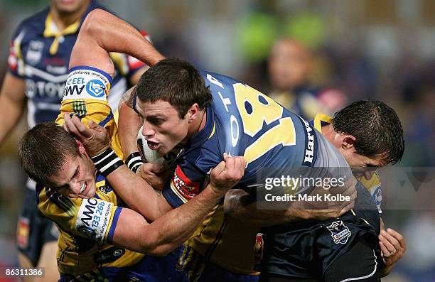 Dayne Weston of the Cowboys is tackled during the round eight NRL match between the Parramatta Eels and the North Queensland Cowboys at Parramatta...