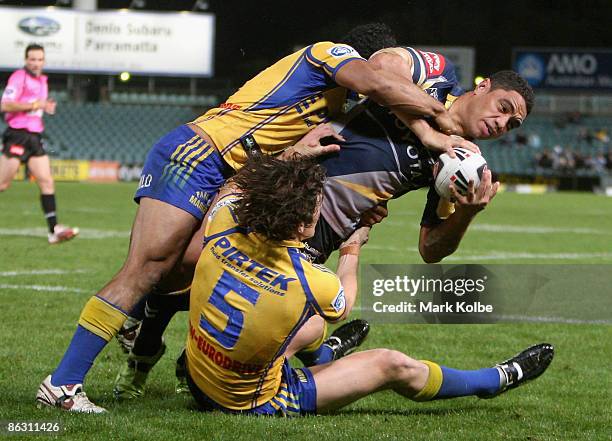 Willie Tonga of the Cowboys is tackled during the round eight NRL match between the Parramatta Eels and the North Queensland Cowboys at Parramatta...