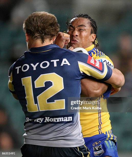 Fuifui Moimoi of the Eels is it by heavy defence during the round eight NRL match between the Parramatta Eels and the North Queensland Cowboys at...