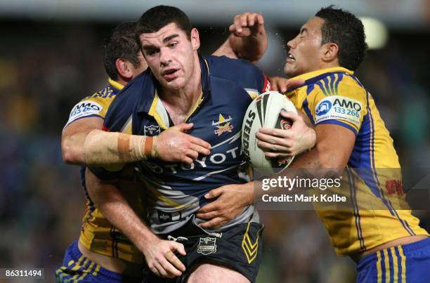 Scott Tronc of the Cowboys is tackled during the round eight NRL match between the Parramatta Eels and the North Queensland Cowboys at Parramatta...