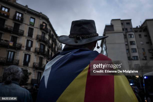 Protesters gather outside the building that houses the representation of the Spanish government to demonstrate against the pending triggering of...
