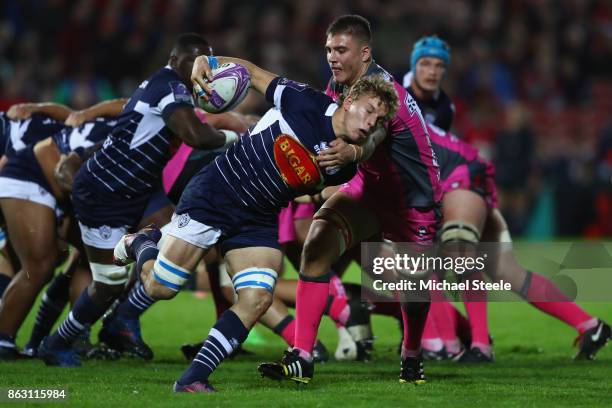 Leo Ghirard of Agen is held up by Jake Polledri of Gloucester during the European Rugby Challenge Cup Pool 3 match between Gloucester and Agen at...