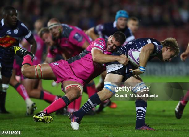 Leo Ghirard of Agen is held up by Jake Polledri of Gloucester during the European Rugby Challenge Cup Pool 3 match between Gloucester and Agen at...