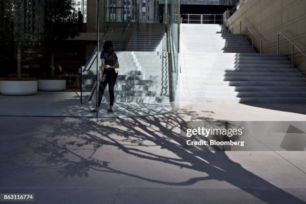 An employee stands inside during a media preview of the new Apple Inc. Michigan Avenue store in Chicago, Illinois, U.S., on Thursday, Oct. 19, 2017....