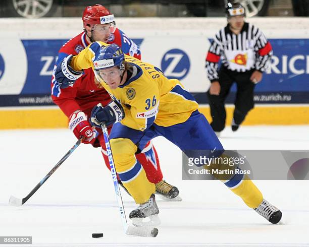 Anton Stralman of Sweden skates with the puck during the IIHF World Ice Hockey Championship qualification round match between Russia and Sweden at...