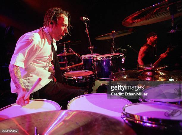 Sevendust drummer Morgan Rose and guitarist John Connolly perform at the Marquee Theatre April 29, 2009 in Tempe, Arizona. The rock group is touring...