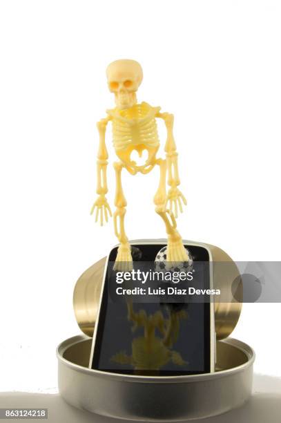 human skeleton with a ball of football - stadium screen stock pictures, royalty-free photos & images