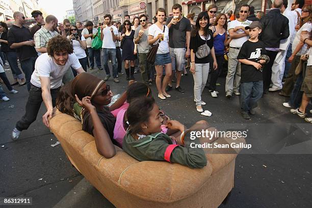Family gets a couch potato ride at the annual MyFest May Day celebration in Kreuzberg on May 1, 2009 in Berlin, Germany. Over 5,000 police officers...