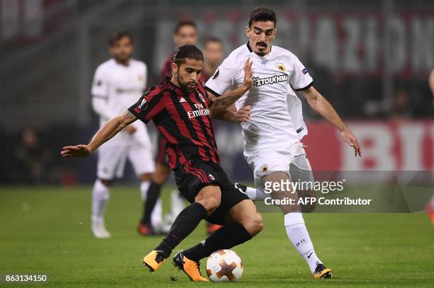 Milan's defender Ricardo Rodriguez from Switzerland fights for the ball with AEK's midfielder Lazaros Christodoulopoulos from Greece during the UEFA...
