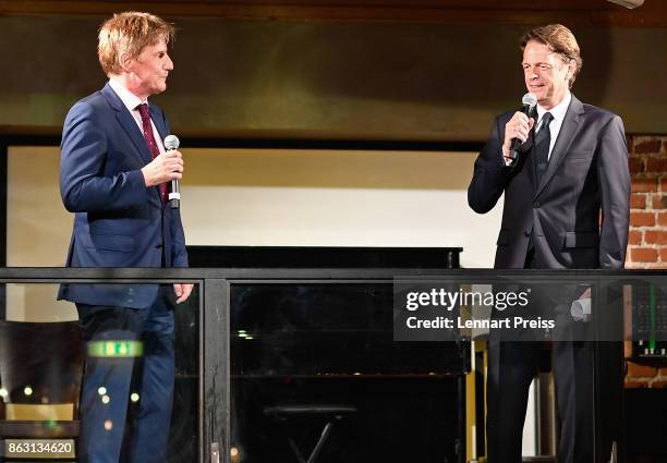 Presenter Rudi Cerne and producer Martin Gross speak during the 'Aktenzeichen XY... Ungeloest' 50th anniversary celebration at Park Cafe on October...