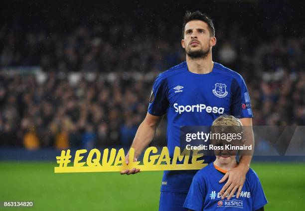 Kevin Mirallas of Everton holds the #equalgame banner prior to the UEFA Europa League Group E match between Everton FC and Olympique Lyon at Goodison...