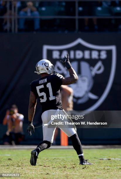 Bruce Irvin of the Oakland Raiders reacts after a play against the Los Angeles Chargers during an NFL football game at Oakland-Alameda County...