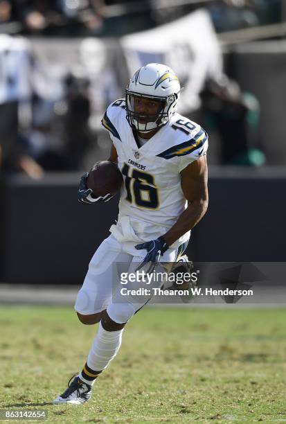 Tyrell Williams of the Los Angeles Chargers runs with the ball after catching a pass against the Oakland Raiders during an NFL football game at...