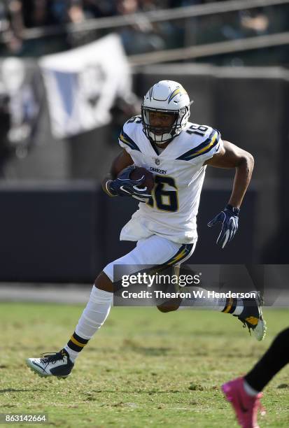 Tyrell Williams of the Los Angeles Chargers runs with the ball after catching a pass against the Oakland Raiders during an NFL football game at...