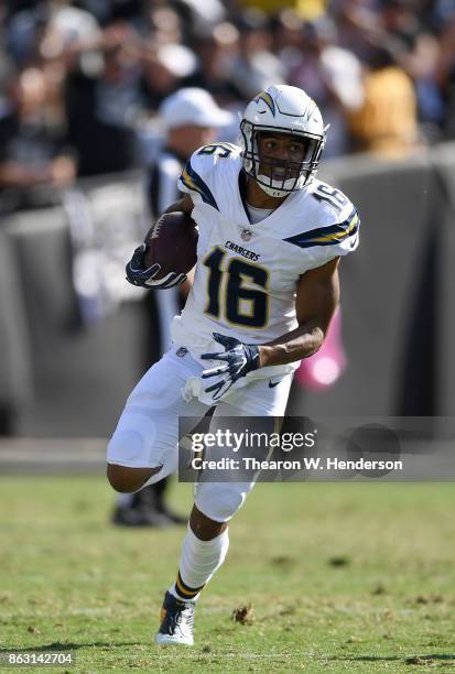 Tyrell Williams of the Los Angeles Chargers runs with the ball after catching a pass against the Oakland Raiders during an NFL football game at...