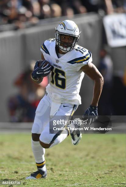 Tyrell Williams of the Los Angeles Chargers runs with the ball after catching a pass against the Oakland Raiders during an NFL football game at...