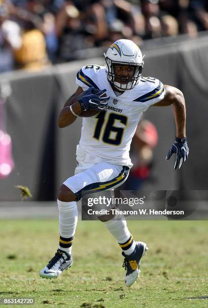 Tyrell Williams of the Los Angeles Chargers runs with the ball after catching a pass against the Oakland Raiders during an NFL football game at...