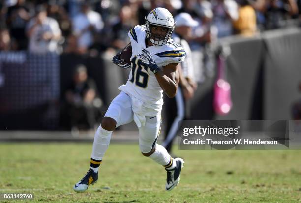 Tyrell Williams of the Los Angeles Chargers runs with the ball after catching a pass against the Oakland Raiders during an NFL football game at...