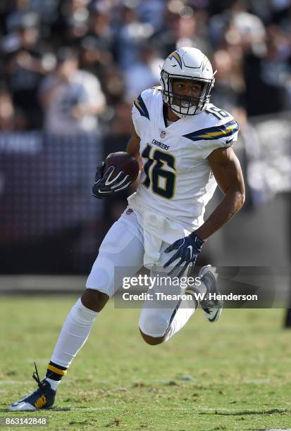 Tyrell Williams of the Los Angeles Chargers runs with the ball after catching a pass against the Oakland Raiders during an NFL football game at...