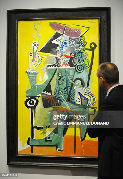 "Mousquetaire a la pipe" by artist Pablo Picasso is on displays at Christie's during a press preview of their Impressionist and Modern Art Evening...