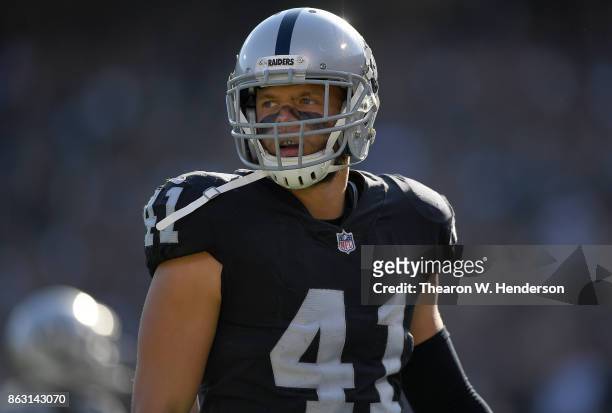 Erik Harris of the Oakland Raiders reacts after making a play on punt coverage against the Los Angeles Chargers during an NFL football game at...