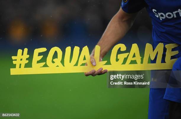 Kevin Mirallas of Everton holds the #equalgame banner prior to the UEFA Europa League Group E match between Everton FC and Olympique Lyon at Goodison...