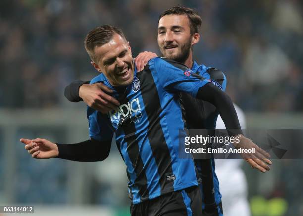 Josip Ilicic of Atalanta BC celebrates with his team-mate Bryan Cristante after scoring the opening goal during the UEFA Europa League group E match...
