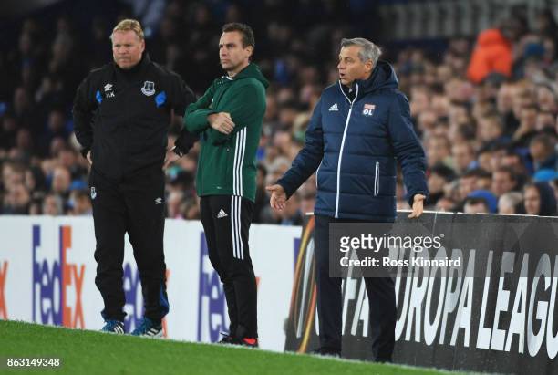 Ronald Koeman, Manager of Everton and Bruno Genesio manager of Lyon look on from the touchline during the UEFA Europa League Group E match between...